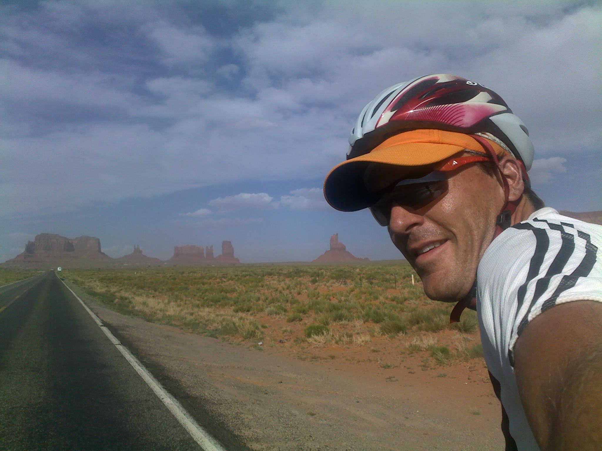 Vin Cox riding down Monument Valley